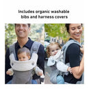 Graco Cradle Me 3-in-1 Baby Carrier in Charcoal Grey shown being used by a smiling man and woman, each carrying a baby.