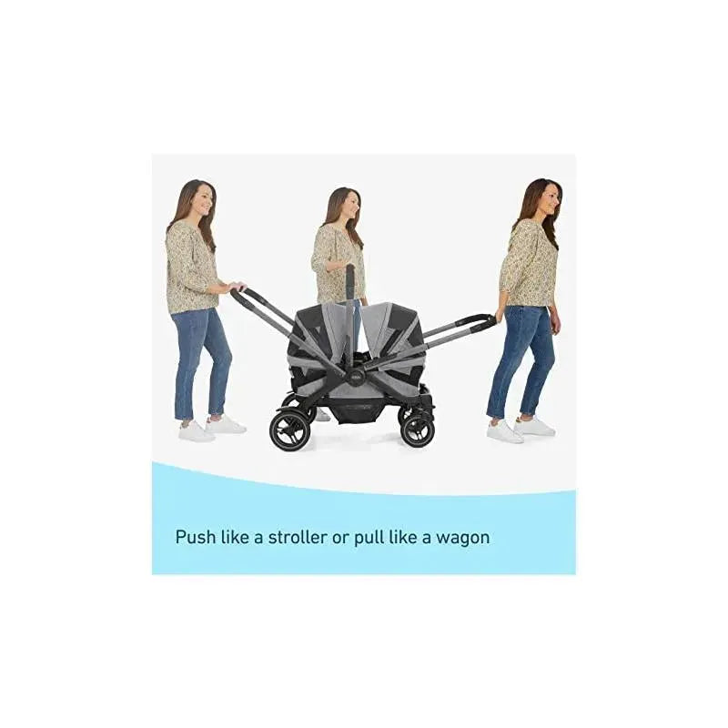 Graco Modes Adventure Stroller Wagon in Teton design, shown being pushed and pulled by a woman in casual attire.