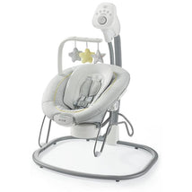 Portable baby swing and bouncer seat in gray and white, featuring toys, music controls, and a secure harness.