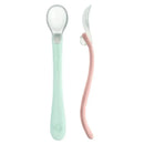 Silicone baby spoons in light sage and light grapefruit, featuring a clear scoop and ergonomic design for easy feeding.