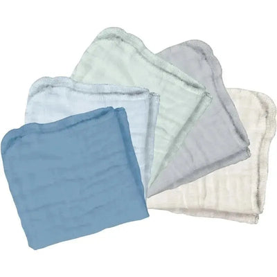 Absorbent organic cotton muslin cloths in shades of blue, green, gray, and white, displayed in a layered arrangement.