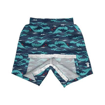 Navy, aqua, and gray colorblock swim trunks featuring a wave pattern, designed for easy changing.