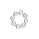 Clear, circular teether with multiple textured knobs designed for soothing infants during teething.