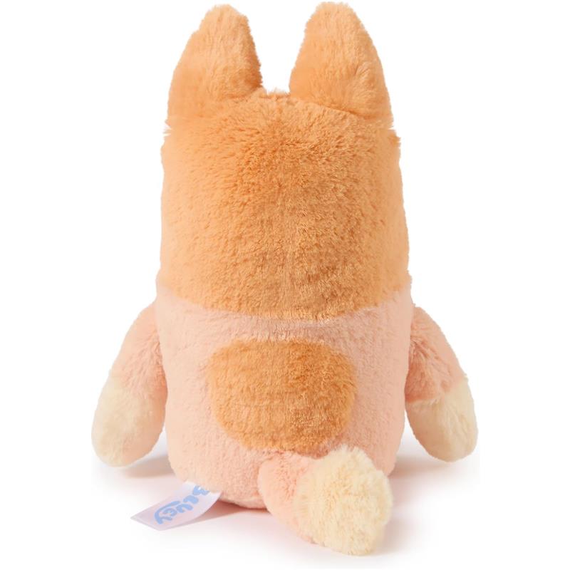 Plush toy of a orange and cream Bingo character, featuring soft fur and a tag, positioned facing away.