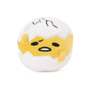 Round squishy plush toy depicting Gudetama, the lazy egg character, with a cracked egg shell and a tired expression.