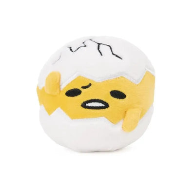 Round squishy plush toy depicting Gudetama, the lazy egg character, with a cracked egg shell and a tired expression.