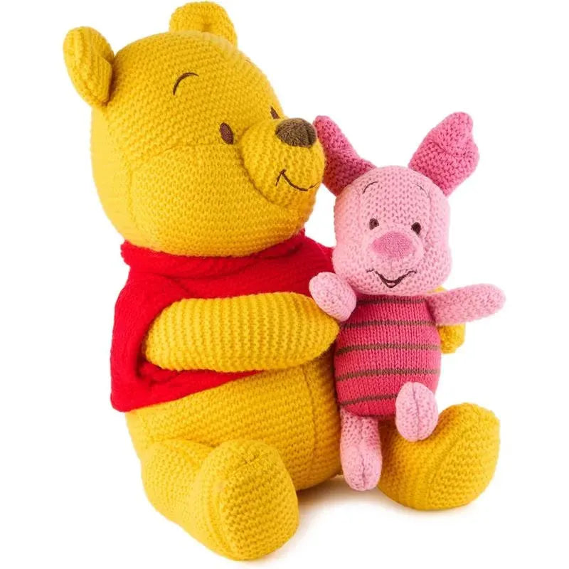 Knit plush toy set featuring Winnie the Pooh in a red shirt and Piglet in pink stripes, designed for cuddling.