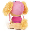 Plush toy of Skye from Paw Patrol, featuring a pink outfit and fluffy yellow ears, sitting upright.
