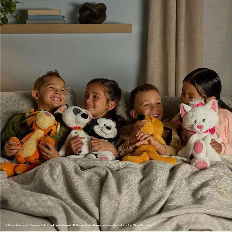 Four children sitting on a sofa, each holding various plush toys, including a tiger, dog, bear, and cat, smiling happily.