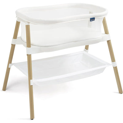 HALO BassiNest Essential Sleeper in white with mesh sides, gold legs, and a storage shelf underneath.