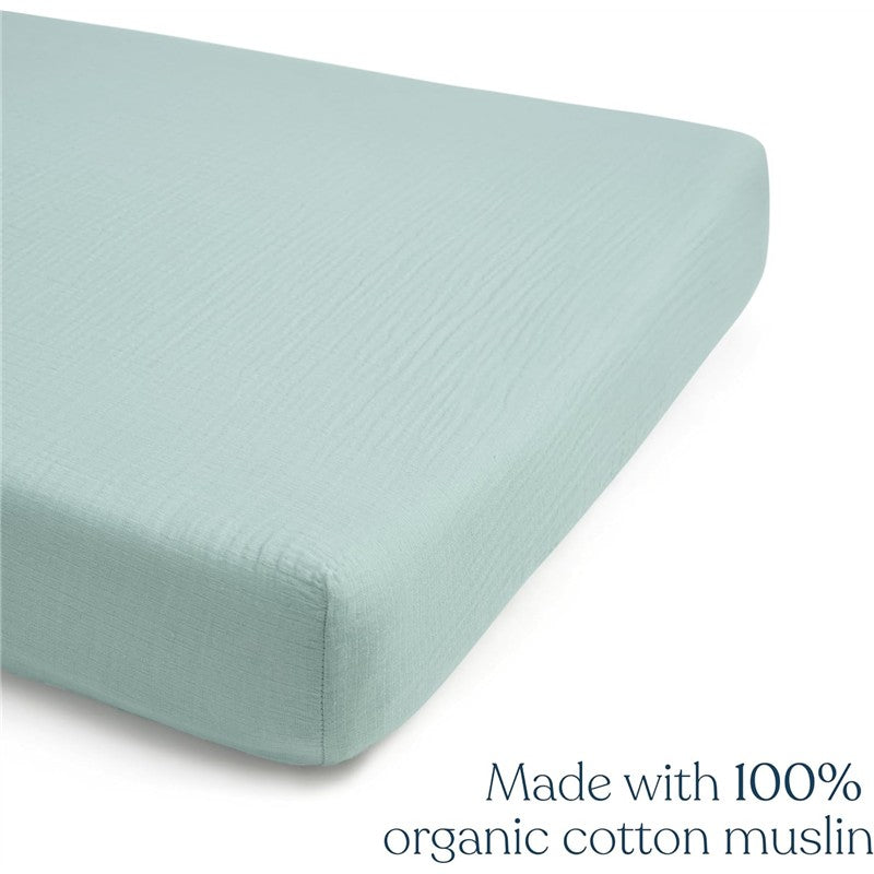 Full-size crib sheet in calm sage color, made from 100% organic cotton muslin, featuring a smooth texture.