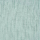 Full-size fitted crib sheet in calm sage green, featuring a soft, textured fabric with a subtle pattern.
