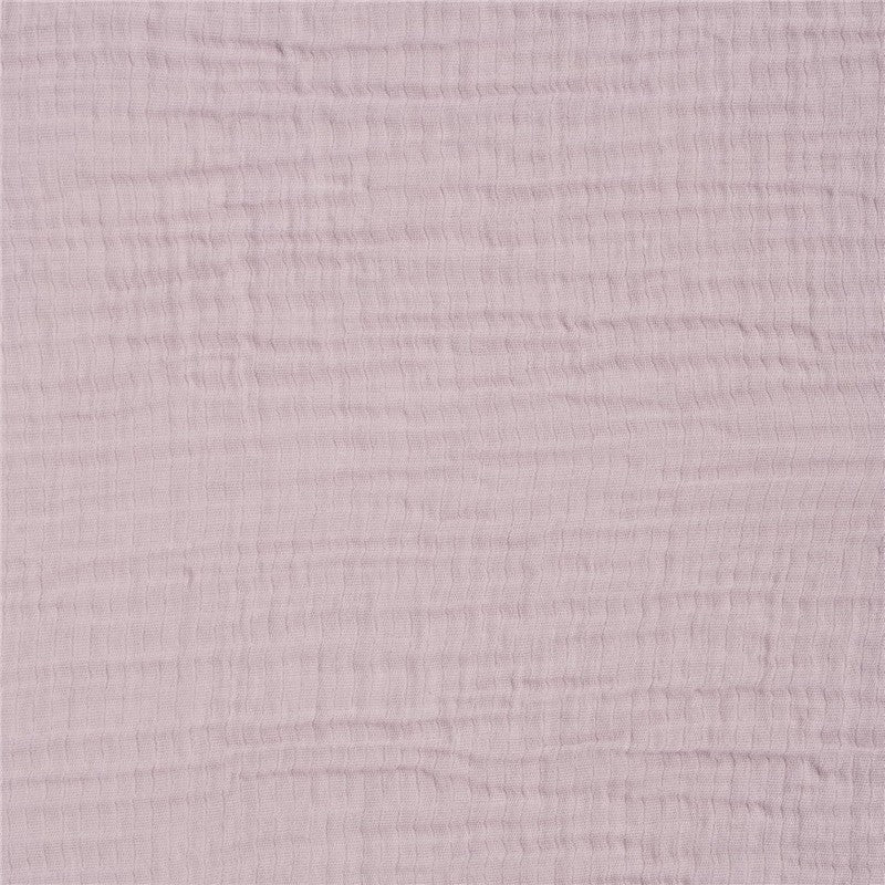 Mauve textured fabric of a HALO full-size fitted crib sheet, showcasing its soft, breathable material.