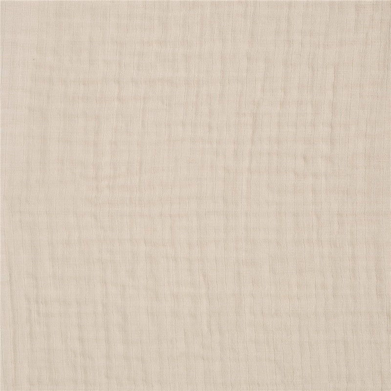 Full-sized fitted crib sheet in soft oat color, featuring a textured, breathable fabric suitable for infants.
