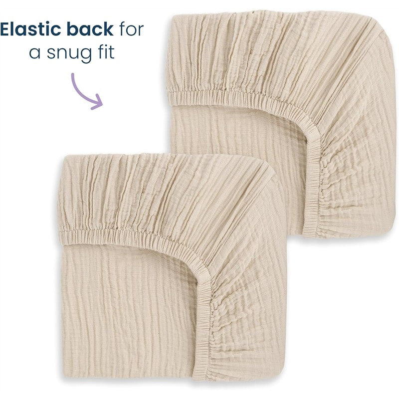 Full-size fitted crib sheets in oat color, featuring an elastic back for a snug fit. Each pack contains two sheets.