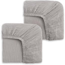 Two storm grey fitted crib sheets, showcasing a soft, textured fabric with elastic edges for secure fit.