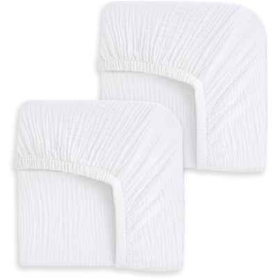Fitted crib sheets in white, showcasing two sheets with elastic corners for easy fit on standard cribs.