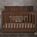 Fitted crib sheet pack description with crib dimensions, suitable for standard cribs and toddler beds, shown with wooden crib.