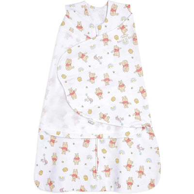 HALO SleepSack Swaddle in 100% cotton, featuring a Winnie the Pooh and rainbow pattern, 1.5 TOG for warmth.