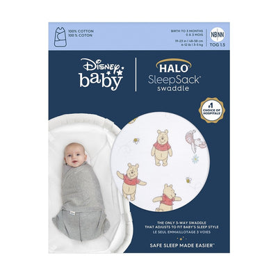 Halo SleepSack Swaddle in 100% cotton featuring Winnie the Pooh design, suitable for infants 0-3 months.