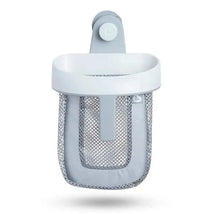 Grey hanging bath toy storage by Munchkin featuring a mesh bag with a white plastic trim and suction mount for easy attachment.