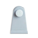 Grey hanging bath toy storage by Munchkin featuring a heart-shaped suction mechanism for easy attachment.