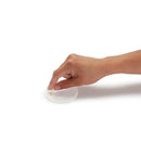 A hand placing a suction cup on a smooth surface, demonstrating the functionality of the Munchkin Hanging Bath Toy Storage.