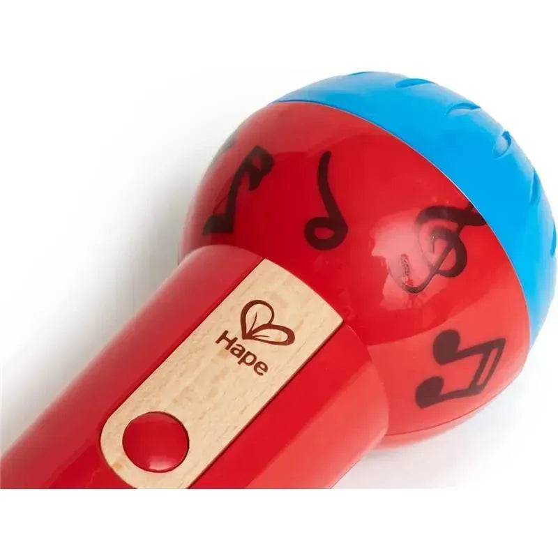 Red and blue Hape Mighty Echo Microphone with musical notes and a wooden label, designed for children’s play.