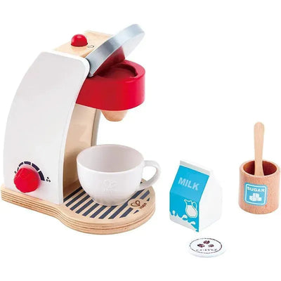 Wooden coffee machine play set featuring a red coffee maker, cup, milk carton, sugar container, and a stirring spoon.