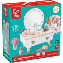 Hape My Stylish Dressing Table toy set featuring a vanity with lights, mirror, hair dryer, and makeup accessories, suitable for ages 3-8.