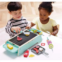 Children playing with the Hape Sizzling Griddle & Grill BBQ, using toy food items and utensils on a colorful griddle.