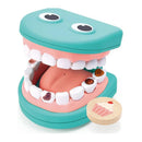 Hape Super Smile Dental Clinic Set features a colorful, open-mouth dental model with removable teeth showing cavities and a sweet treat token.