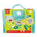 Hape Super Smile Dental Clinic Set displayed with a turquoise bag, dental tools, toy teeth, and accessories for imaginative play.