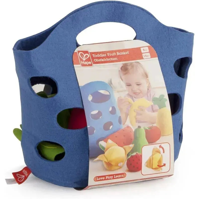 Blue felt basket filled with colorful toy fruits and a label featuring a child playing with it, promoting learning through play.