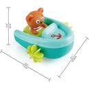 Pull-back bath toy featuring a cute bear in a green and blue boat, complete with an anchor and leaf accents.