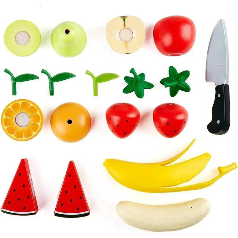 Wooden play fruits including apples, bananas, oranges, and strawberries, alongside a toy knife for cutting.