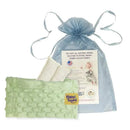Green Happi Tummi aromatherapy wrap for babies, accompanied by herbal inserts and a informational pouch.