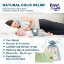 Happi Tummi pink colic relief aromatherapy wrap for babies, used by a mother soothing her sleeping infant.