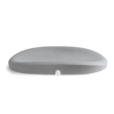 Grey changing pad and scale designed for infants, featuring a smooth surface and digital scale display on the side.