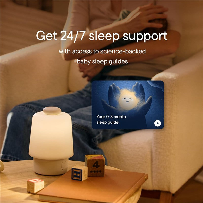 Hatch Baby Sleep Support product on a table, with a soft night light and a guide for 0-3 month baby sleep support.