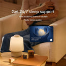 Hatch Baby Sleep Support product on a table, with a soft night light and a guide for 0-3 month baby sleep support.