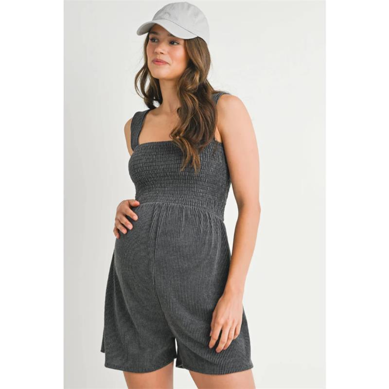 Ribbed smocked maternity knit romper in charcoal worn by a pregnant woman, featuring a square neckline and shorts.