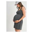Charcoal ribbed smocked maternity knit romper worn by a pregnant woman, gently cradling her belly.