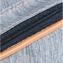 Grey fabric of the Hug - New York Backpack featuring a sturdy zipper with tan piping.