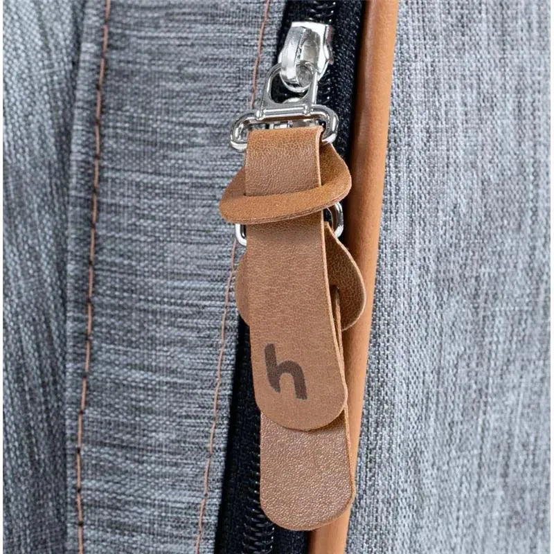 Grey Hug - New York Backpack zipper detail featuring a leather pull tab with an embossed number.