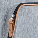 Grey fabric backpack with a zipper featuring a brown leather pull tab and stitching details.