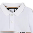 Long sleeve black and white polo shirt by Hugo Boss for boys, featuring a classic collar and button closure.