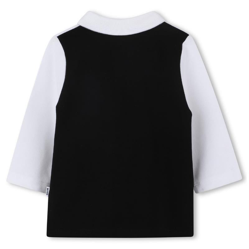 Long sleeve black and white polo shirt for boys by Hugo Boss, featuring a solid black back and white sleeves.