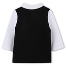 Long sleeve black and white polo shirt for boys by Hugo Boss, featuring a solid black back and white sleeves.