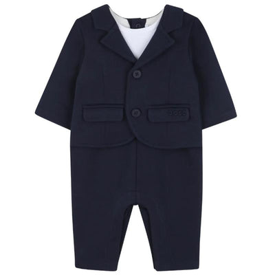 Navy blue suit-style romper for boys by Hugo Boss, featuring a blazer top, white undershirt, and two front pockets.